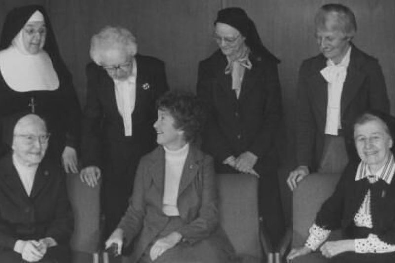 A black and white photo of past St. Catherine presidents, all women, sitting together.
