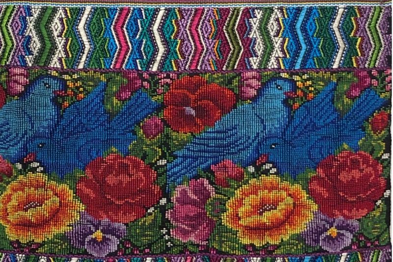 Colorful textile from Pacha show with birds and flowers