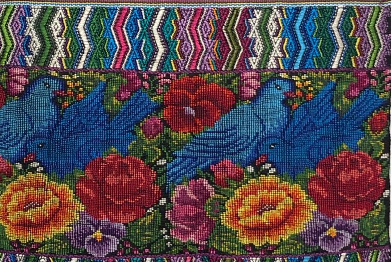 Colorful textile from Pacha show with birds and flowers